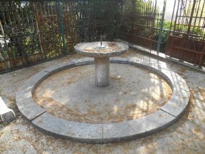 Round white marble fountain